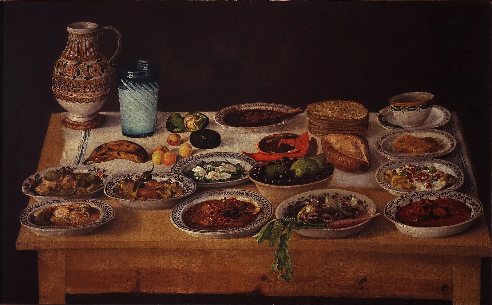 Painting of a table in a Puebla kitchen loaded with bowls of cooked dishes, tortillas and a jug