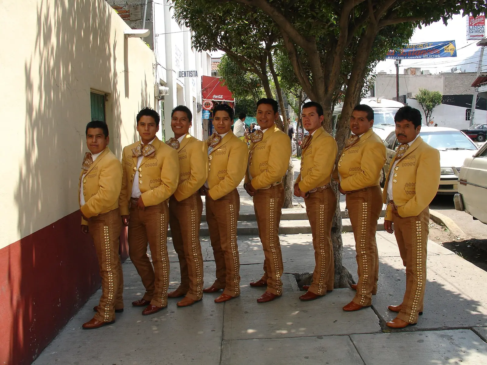 Mariachi musicians in gold suits. Go to music and dance